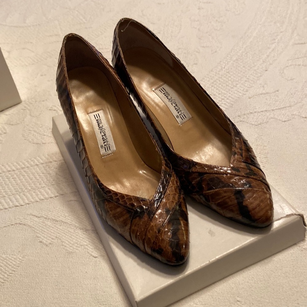 Brown and black snakeskin pumps